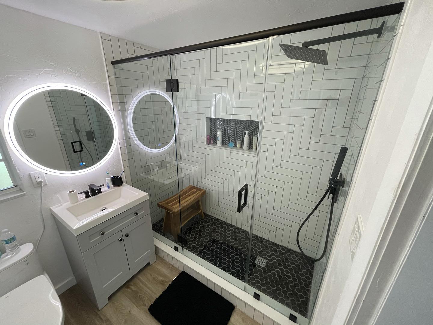 Modern frameless glass shower enclosure in a residential bathroom