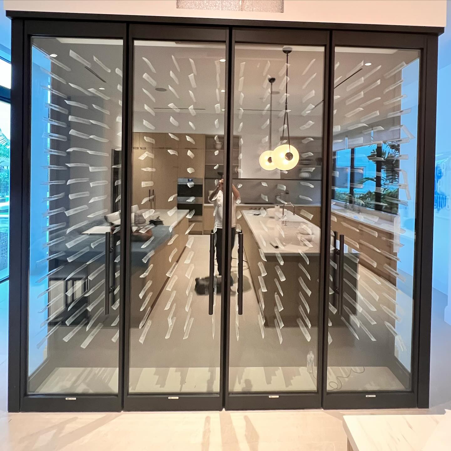 Custom glass wine room installed by Architectural Glass and Design