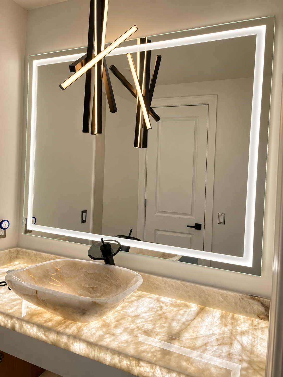 Custom decorative wall mirror installation by Architectural Glass and Design