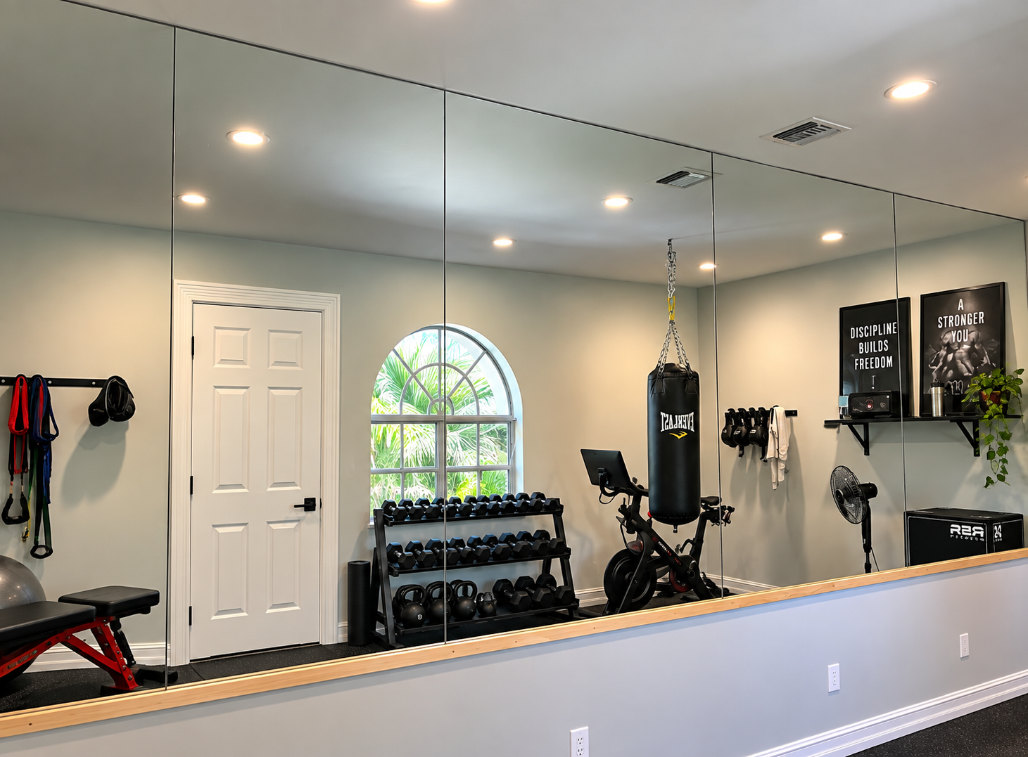 Custom decorative wall mirror installation by Architectural Glass and Design